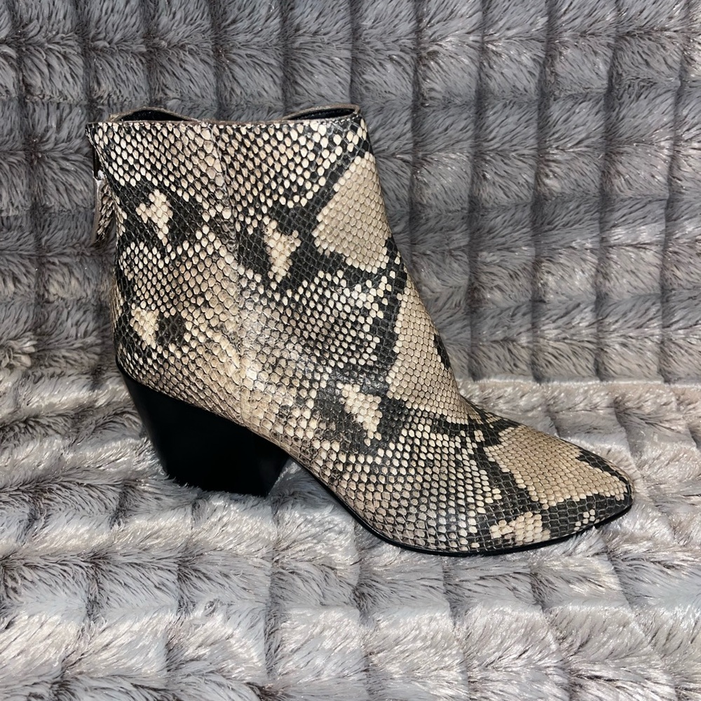 Women’s 8 Dolce Vita Snake print booties.